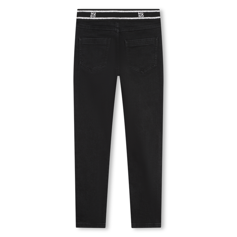 Jean moulant à taille à sigles Hugo 
                    FILLE