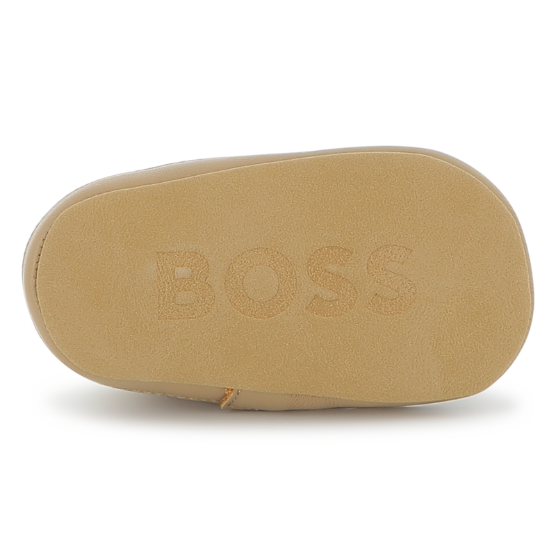 Chaussons souples en cuir de mouton BOSS 
                    UNISEXE