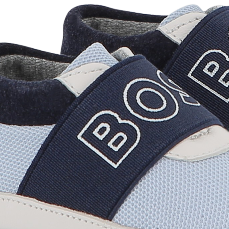 Chaussons souples en cuir de mouton BOSS 
                    UNISEXE